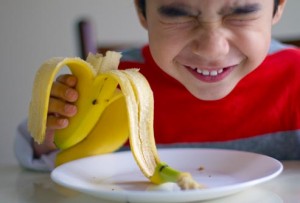 getty_rf_photo_of_boy_eating_banana